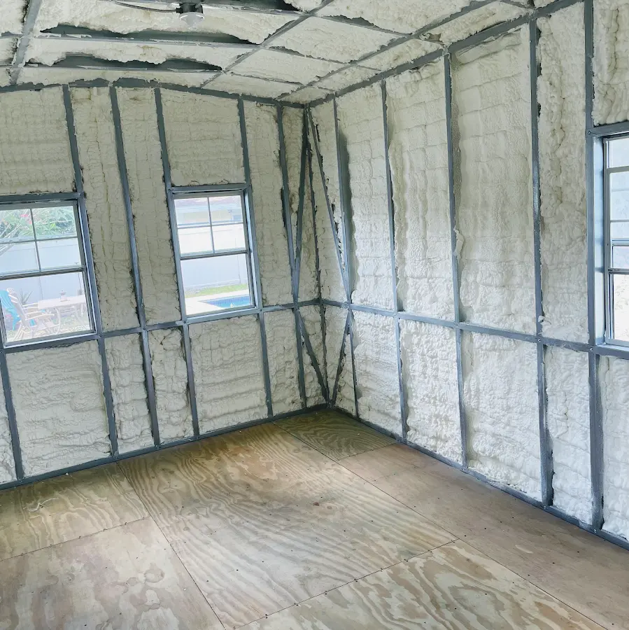 Closed-cell spray foam insulation applied to wall cavities in a residential project in Merced
